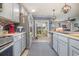 Open kitchen with island and view to backyard through sliding doors at 197 Golden Bear Circle, Longs, SC 29568