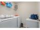 Laundry room with washer, dryer, and shelving at 197 Golden Bear Circle, Longs, SC 29568
