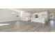 Open concept dining area with wood-look floors and kitchen view at 1020 Barrington Way, Conway, SC 29526
