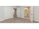 Bedroom with carpet, double doors to bathroom and hallway at 1020 Barrington Way, Conway, SC 29526