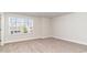 Well-lit bedroom with window and neutral decor at 1020 Barrington Way, Conway, SC 29526