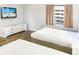 Bedroom with two twin beds and dresser at 202 74Th Ave. N # 2447-2448, Myrtle Beach, SC 29572