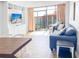 Living room with ocean view, comfy sofa, and dining area at 202 74Th Ave. N # 2447-2448, Myrtle Beach, SC 29572