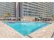 Large outdoor pool area with multiple lounging areas at 202 74Th Ave. N # 2447-2448, Myrtle Beach, SC 29572