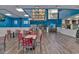 Bright dining area with multiple tables and chairs at 202 74Th Ave. N # 2447-2448, Myrtle Beach, SC 29572