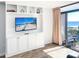 Living room with built-in entertainment center and ocean view at 202 74Th Ave. N # 2447-2448, Myrtle Beach, SC 29572