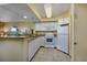 White kitchen with granite countertop and appliances at 2504 N Ocean Blvd. # 1634, Myrtle Beach, SC 29577