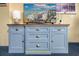 Handcrafted blue cabinet with TV and drawers at 2504 N Ocean Blvd. # 1634, Myrtle Beach, SC 29577