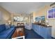 Living room with blue sofa, TV, and custom blue cabinet at 2504 N Ocean Blvd. # 1634, Myrtle Beach, SC 29577