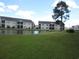 Exterior view of building and pond at 5011 Harvest Dr. # 203, Myrtle Beach, SC 29579