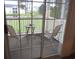Screened balcony overlooking pond and trees at 5011 Harvest Dr. # 203, Myrtle Beach, SC 29579