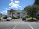 Two-story building with multiple units and parking at 5011 Harvest Dr. # 203, Myrtle Beach, SC 29579