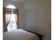 Bedroom with a double bed, large window, and ample closet space at 5011 Harvest Dr. # 203, Myrtle Beach, SC 29579