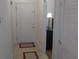A long hallway with a door and a lamp at 5011 Harvest Dr. # 203, Myrtle Beach, SC 29579
