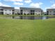 Exterior of building near pond at 5011 Harvest Dr. # 203, Myrtle Beach, SC 29579