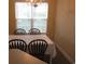 Dining room with table and chairs near a window at 5011 Harvest Dr. # 203, Myrtle Beach, SC 29579
