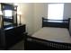 Well-lit bedroom with a double bed and matching dresser and mirror set at 5011 Harvest Dr. # 203, Myrtle Beach, SC 29579