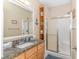 Bathroom with granite countertop, walk-in shower, and built-in shelves at 6001-1889 S Kings Hwy., Myrtle Beach, SC 29575