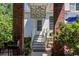 Brick patio with stained glass hanging and lush landscaping at 5356 Hamps Rd., Nichols, SC 29581