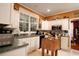 Well-equipped kitchen with white cabinets, granite countertops, and a butcher block island at 5356 Hamps Rd., Nichols, SC 29581