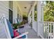 Inviting front porch with rocking chairs and lush landscaping at 5356 Hamps Rd., Nichols, SC 29581