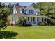 Two-story home with white siding, large front porch, and nicely landscaped lawn at 5356 Hamps Rd., Nichols, SC 29581