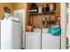Laundry room with washer, dryer, and ample storage shelving at 5356 Hamps Rd., Nichols, SC 29581
