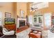 Spacious living room with a brick fireplace, high ceilings, and large windows at 5356 Hamps Rd., Nichols, SC 29581