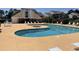 Community pool with a hot tub and lounge chairs at 1025 Plantation Dr. W # 3421, Little River, SC 29566