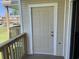 Exterior door to condo with balcony and partial view of complex at 1025 Plantation Dr. W # 3421, Little River, SC 29566