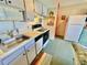 Small kitchen with white cabinets and appliances at 1025 Plantation Dr. W # 3421, Little River, SC 29566