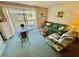 Living room with comfy seating and access to patio at 1025 Plantation Dr. W # 3421, Little River, SC 29566