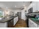 Bright kitchen featuring stainless steel appliances and an island at 238 Marauder Dr., Longs, SC 29568
