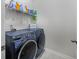 Well-equipped laundry room with washer, dryer, and shelving at 238 Marauder Dr., Longs, SC 29568
