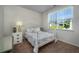 Charming bedroom with white metal bed frame and floral bedding at 238 Marauder Dr., Longs, SC 29568