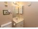 Small bathroom with sink, mirror, and toilet at 4305 S Ocean Blvd. # 106, North Myrtle Beach, SC 29582