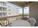Ocean view balcony with table and chairs at 4305 S Ocean Blvd. # 106, North Myrtle Beach, SC 29582