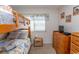 Bunk beds in a well-lit bedroom with wood dresser at 4305 S Ocean Blvd. # 106, North Myrtle Beach, SC 29582