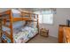 Bedroom with a bunk bed and window at 4305 S Ocean Blvd. # 106, North Myrtle Beach, SC 29582