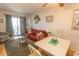 Living room features sofa, chairs, and access to balcony at 4305 S Ocean Blvd. # 106, North Myrtle Beach, SC 29582