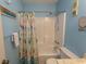 Clean bathroom with shower/tub combo and beachy decor at 4305 S Ocean Blvd. # 106, North Myrtle Beach, SC 29582