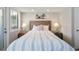 Bedroom with a queen bed, nightstands and striped bedding at 351 Lake Arrowhead Rd. # 11-342, Myrtle Beach, SC 29572