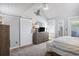 Spacious bedroom with a barn door, dresser, and striped bedding at 351 Lake Arrowhead Rd. # 11-342, Myrtle Beach, SC 29572