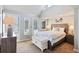 Main bedroom with a queen bed, nightstands, and access to a private balcony at 351 Lake Arrowhead Rd. # 11-342, Myrtle Beach, SC 29572
