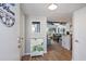 Bright and welcoming entryway with decorative cabinet and view of living area at 351 Lake Arrowhead Rd. # 11-342, Myrtle Beach, SC 29572