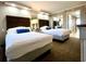 Two twin beds, dresser, and mirrored closet at 6900 Ocean Blvd. # 936, Myrtle Beach, SC 29572