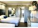 Two twin beds, dresser, and mirrored closet at 6900 Ocean Blvd. # 936, Myrtle Beach, SC 29572