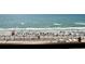 Balcony view of the beach with ocean and people at 6900 Ocean Blvd. # 936, Myrtle Beach, SC 29572