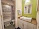 Small bathroom with a white sink and patterned tile shower at 226 Westleton Dr. # 19-D, Myrtle Beach, SC 29572