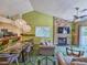 Bright living room with stone fireplace and green carpet at 226 Westleton Dr. # 19-D, Myrtle Beach, SC 29572
